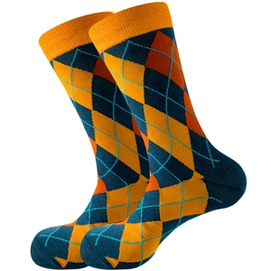 Detail of argyle pattern socks featuring vibrant orange and blue knitted textures