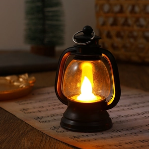 Macro detail of a vintage black LED lantern on music sheets for Christmas decoration