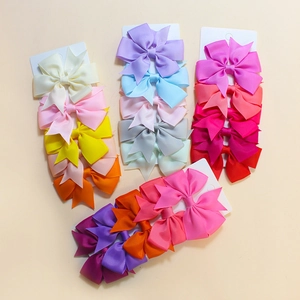 Assorted colorful ribbed ribbon fishtail bow hair clips set on display cards