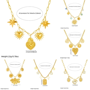 Vintage gold plated stainless steel necklaces with heart and sun pendants on white background