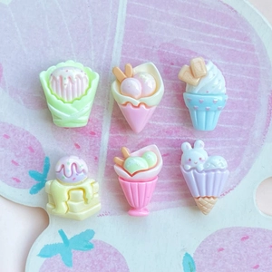 Macro view of six colorful resin dessert miniatures including ice cream and cupcakes