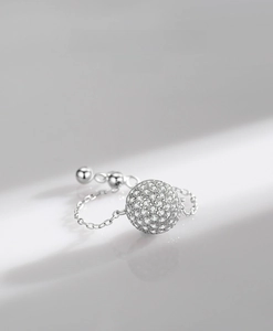 Macro view of S925 sterling silver chain ring with a micro-pave diamond-set spherical bead