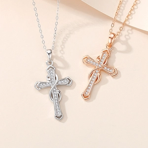 Sterling silver infinity cross necklace with rose gold accents and pavé zirconia stones