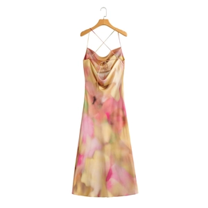 Satin tie-dye long dress with criss-cross back and cowl neck on a wooden hanger