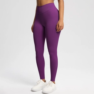 Detail view of purple high-waisted seamless yoga leggings with breathable performance fabric