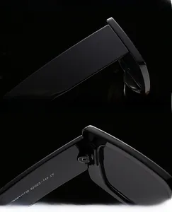 Detail of square sunglasses showing UV protection lenses and durable reinforced hinges