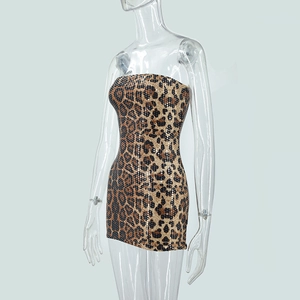Macro shot of shimmering sequins and leopard print texture on a strapless dress