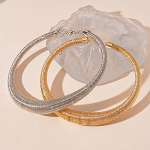 Exaggerated metal circle choker necklace in gold and silver finish with spring texture