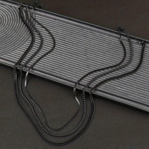Black 3mm Franco chain necklace made of stainless steel displayed on a rippled tray