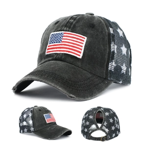 Detailed view of washed cotton ponytail baseball cap with American flag embroidery