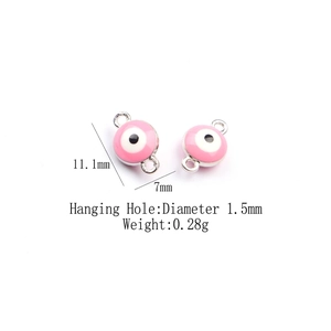 Detail of pink enamel evil eye charms showing dimensions of 11.1mm with double loops