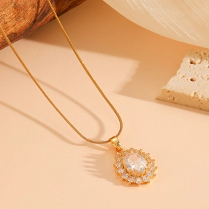 Elegant gold titanium steel necklace with oval crystal pendant surrounded by small diamonds