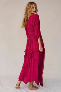Macro detail of tiered ruffles and textured fabric on the raspberry pink maxi dress