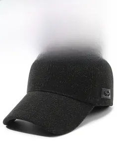 Detailed close-up of dark grey wool baseball cap showing thick fabric texture and side label