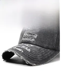 Close-up of vintage distressed baseball cap with embroidery and frayed brim details