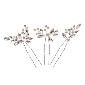 Three-piece silver hair pin set with irregular crystal leaves on white background