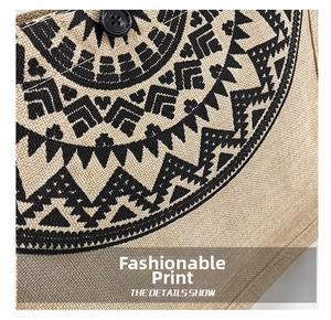 Detail of ethnic geometric print on linen fabric with black round button fastener