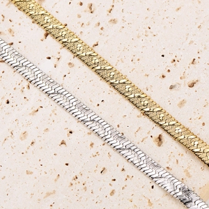 Textured flat snake bone necklace in gold and silver stainless steel for women