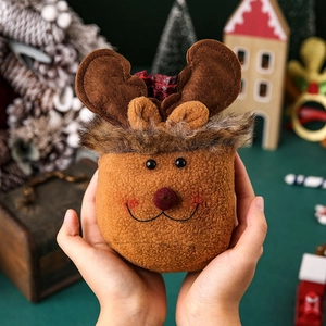 Christmas plush reindeer gift bag with red plaid drawstring and cozy fleece texture