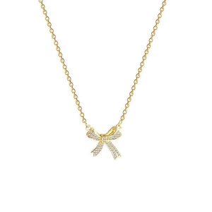 Elegant gold bow necklace with sparkling crystals and minimalist dainty chain link