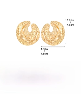 Detail view of large gold matte irregular texture earrings with exact size measurements