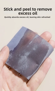 Detailed demonstration of bamboo charcoal blotting paper absorbing facial oil on skin surface