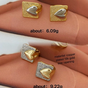 Dual-tone 18k gold plated heart rings with cubic zirconia pavé and open design
