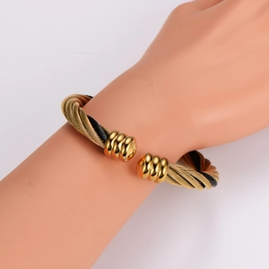 Adjustable stainless steel cable wire bangle in gold and black woven design for women