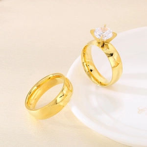 Polished 6mm gold stainless steel ring set with a round-cut zircon solitaire