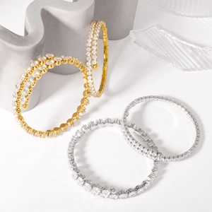 Sparkling pave-set cubic zirconia open bangle bracelets in gold and silver finish