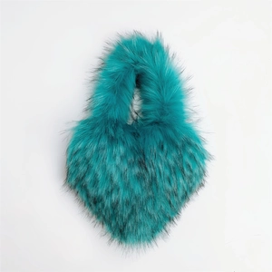 Detail of teal faux fur crossbody bag showing fluffy texture and black tipped plush hairs