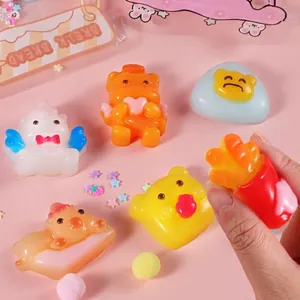 Buntes DIY Squishy Spielzeugset mit Einhorn- und Bärenfiguren auf rosa Dekohintergrund