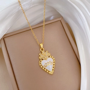 Luxurious gold titanium necklace with a white enamel heart crown pendant on silk base