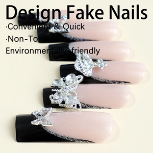Extra-long French fake nails with black and white design and crystal butterfly rhinestones