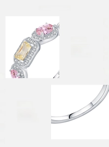 Detail of S925 sterling silver ring with yellow and pink cubic zirconia stones