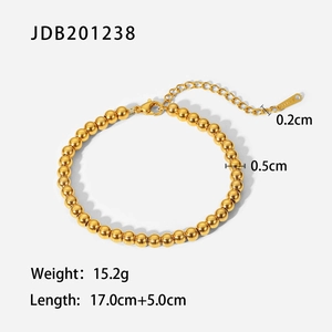 Detail of 18K gold plated steel bead bracelet with 0.5cm beads and lobster clasp