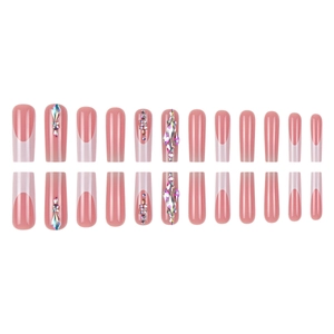 White French tip press-on nails in nude pink base with colorful rhinestone accents