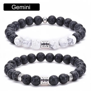 Detail of Gemini couple bracelets with black lava stone and white turquoise beads