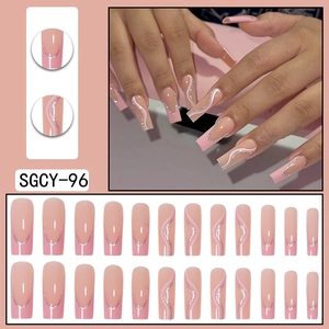 Pink French ballet style press-on nails with white swirl lines and silver glitter accents