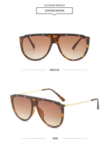 Detailed front and side views of leopard print oversized sunglasses with gold metal temples