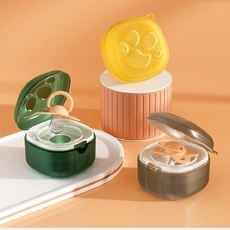 Detailed studio display of multi-color portable silicone pacifier storage boxes and cases