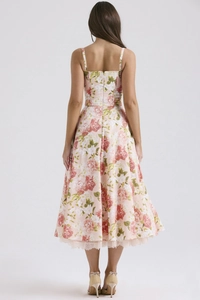 Detailed back view of a floral camisole dress with zipper closure and lace hem