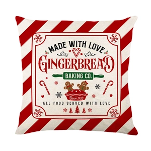 Festive red striped Christmas pillow cover featuring Gingerbread Baking Co. print