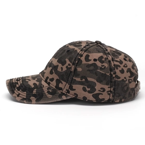 Detail of vintage washed cotton leopard print baseball cap with heavy canvas texture