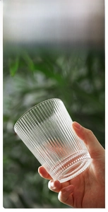 Detail shot of vertical ribbed glass texture with a clear polished finish for anti-slip grip