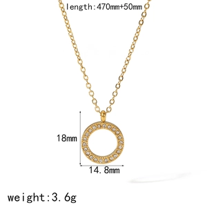 Detail view of gold round pendant necklace with dimensions 18mm by 14.8mm and shiny stones