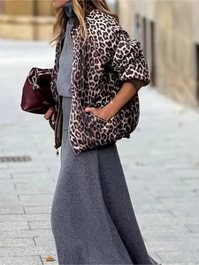 Street style leopard print puffer jacket paired with a slim-fit grey maxi knit dress