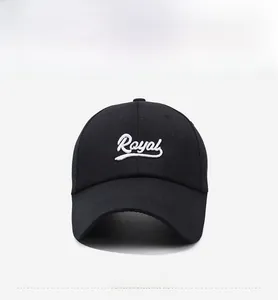 Detailed view of white Royal script embroidery on black twill cotton baseball cap
