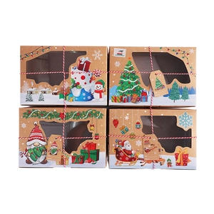 Christmas kraft paper gift boxes with holiday patterns, windows and festive red strings