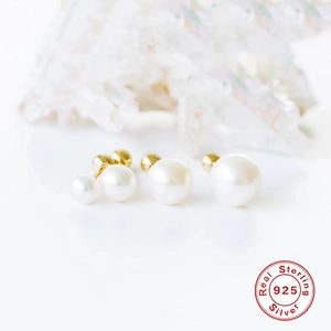 Set of four S925 sterling silver pearl stud earrings in varying sizes on gold base